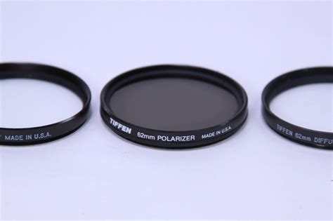 LOT 28 LENS FILTERS + TIFFEN DISPLAY CASE …