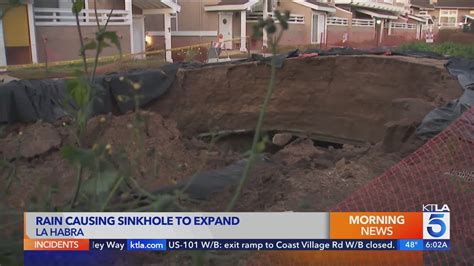 La Habra condo residents battle city over massive sinkhole in their front yards