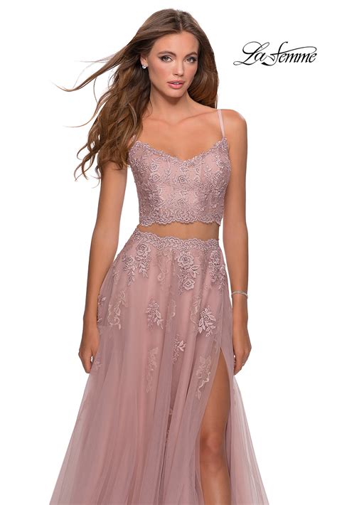 La femme prom dresses 2023. Color. Strapless sequin gown with faux wrap skirt. Open back with thick criss-cross straps. Back zipper closure. Dress comes in a different fabric in black and white under number 27035, and wine and navy under 28835. It comes in … 