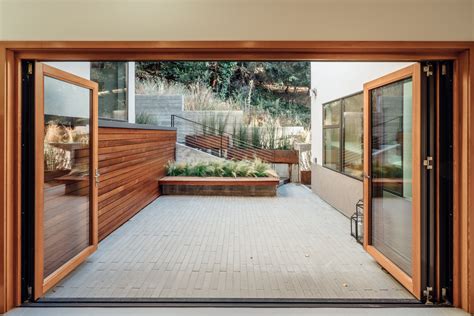 Lacantina doors. The Aluminum Wood system is our unique design innovation based on the same styling as a traditional wood clad door. Built with the highest quality and robust components, the Aluminum Wood system is engineered for large openings requiring oversized door panels. Featuring thicker 2 1/4" panels, the Aluminum Wood system delivers everything you ... 