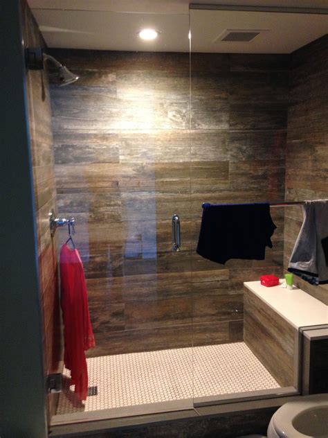 Laminate shower walls. Fibo wall panels are 2’ x 8’ x .378” thick, 2x thicker than Dumawall, and weigh 26 lbs. per panel. On the other hand, you’ll need to put up 6 times more Dumawall faux tiles than Fibo wall panels. Not only will you have 6 times more units in your shower or tub surround to install, but you’ll also have 6 times more seams to seal. 