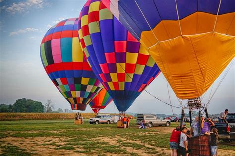 Lancaster hot air balloon festival. People watch hot air balloons take to the skies during the Lancaster Balloon Festival, hosted in Bird-in-Hand and features the mass launch of dozens of hot air balloons on Sunday, Sept. 19, 2021. 