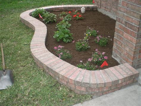Landscaping bricks. Learn how to install clay pavers to form a tidy garden border and separate your lawn from plantings. Follow the 12 steps to lay the bricks, pack the base, fill the gaps, and secure the edging with polymeric sand. 