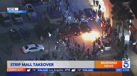 Large crowd, cars burning rubber take over Rosemead shopping center