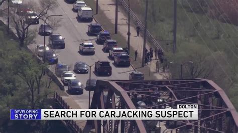 Large police presence in Dolton, search continues for carjacking suspect