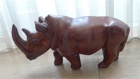 Large wood carving of a rhinoceros - Catawiki