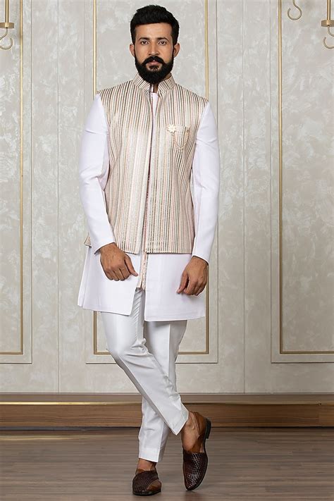 Laromani. Buy Latest Collection of Sherwani with Dupatta. The Sherwani set is a grand & opulent outfit perfect for grooms. This Ethnic outfit consisted of a Sherwani, a kurta, & trousers. The Sherwani was a long coat-like garment that was embroidered with intricate designs for Festive Occasions & Weddings Exclusively Online. 
