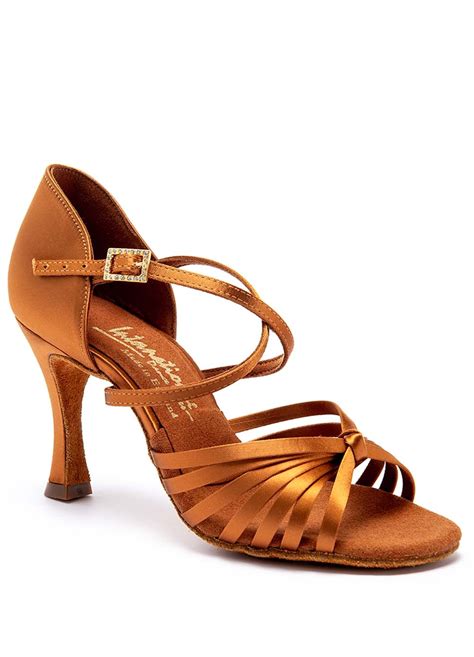 Latin dance shoes. Characteristic Description; Heel: Salsa shoes typically have a 2-3 inch heel to provide support for spins and turns. Sole: The sole should be flexible and made of suede to allow for smooth movement on the dance floor. 