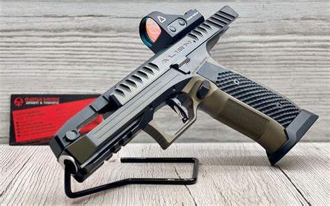 Specifications: Laugo Alien Signature Edition Pistol. Caliber: 9mm Overall Length: 8.2” Barrel Length: 4.8” Width: 1.1” Height: 5.8” Weight (empty): 2.2 lbs Magazine Capacity: 17 rounds Price: about $5000 retail …. 