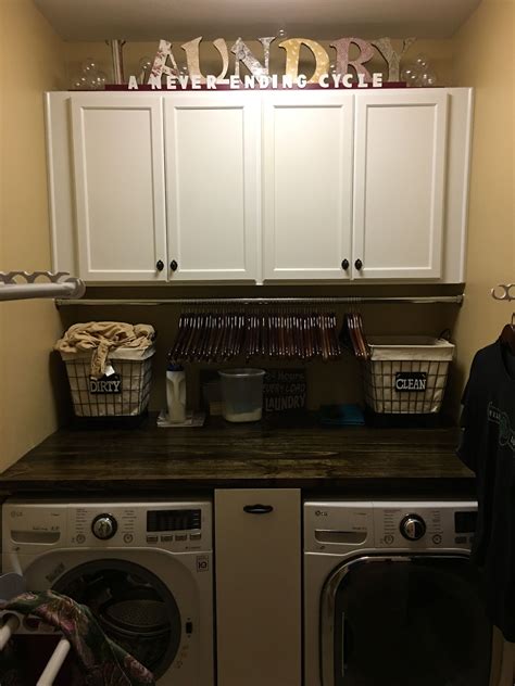 This storage cabinet with doors and shelves is custom-fit to be mounted above your standard-sized washer and dryer, enabling wall cabinets for laundry room storage. The doors open conveniently to either the right or left, depending on your room configuration, providing flexible accessibility.