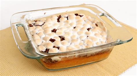 Preheat oven to 350°. In a large bowl, stir together sweet potato, brown sugar, eggs, cream, cinnamon, and salt until well combined. Spoon into an 11x7-inch baking dish. Bake until just set, 45 to 55 minutes. Sprinkle with marshmallows and pecans; bake until top is lightly browned, about 10 minutes more. Let stand for 10 minutes before serving.. 