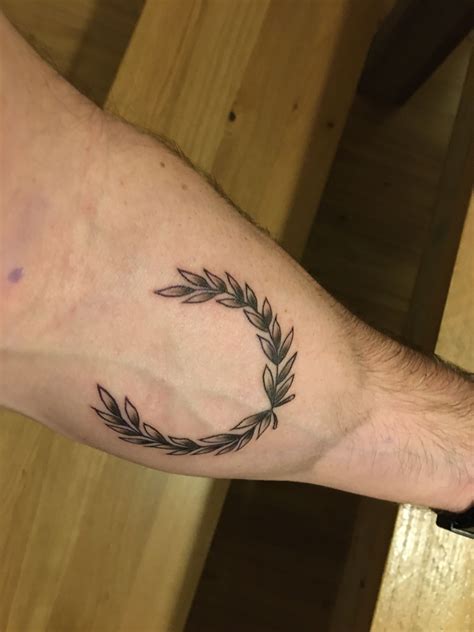 Laurel tattoo. Hey there, ink aficionados! Are you on the hunt for a tattoo that exudes a sense of victory, strength, and honor? Look no further than the laurel wreath tatt... 