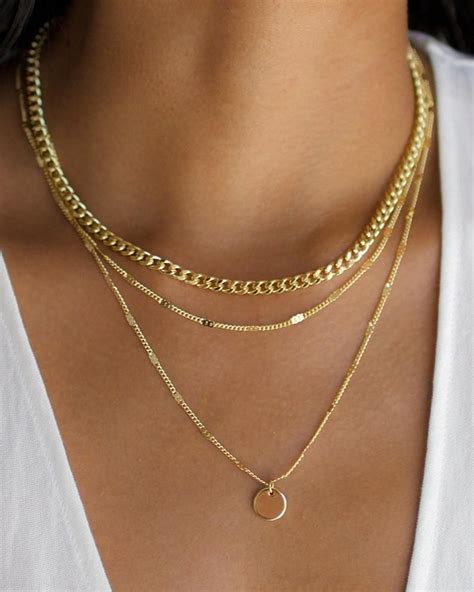 Layered gold necklaces. Layer up this season with our new Layered Chain Necklace. Featuring two modern chains that work together to elevate your basics and compliment your evening ... 