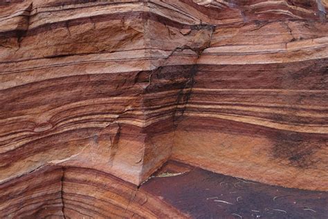 A horizontal layer of material, especially one of several parallel layers arranged one on top of another. 2. Geology A bed or layer of sedimentary rock that is .... 