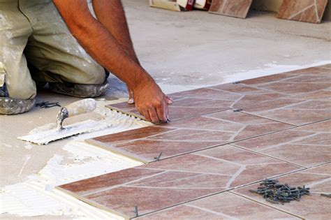 Laying tile. Choosing the right tile for your project is essential when installing tiles over a waterproofing membrane. It would be best if you considered the following factors when making your selection: 1. Tile Material. Tiles are available in various materials, including ceramic, porcelain, natural stone, and glass. 
