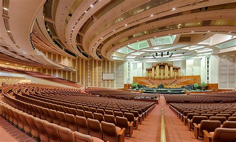 Explore the stunning interior of the LDS Conference Center, a magnificent concert hall with rows of seats and state-of-the-art electronic equipment.. 