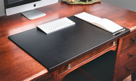 Leather desk pads. Designed with large conference tables in mind, this pad has plenty of room for all your note taking and diagramming. Made from full grain leather, this Classic Conference and Laptop Pad protects your desk from scratches and designates space for your laptop or notebook, giving you a solid base to work on. 