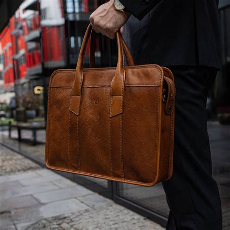 Leather laptop bags for men. A sturdy and smart commuter. This tough yet polished laptop tote bag is thoughtfully designed, with features like internal popout bottle pockets and leakproof zippers. But its durable fabric shell ... 