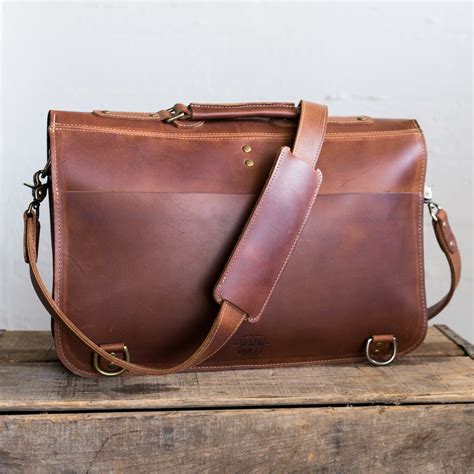 Leather messenger bags men. Specs: 15.5″ x 3.3″ x 10.3″ | 3.3 lbs. Fits laptops up to 14″. Indiana Jones wore the best leather messenger bag for men, but you can get that worn leather look and carry something a little more practical to boot. Kattee makes a tremendous alternative to Dr. Jones’ bag with a lot more room to spare. 