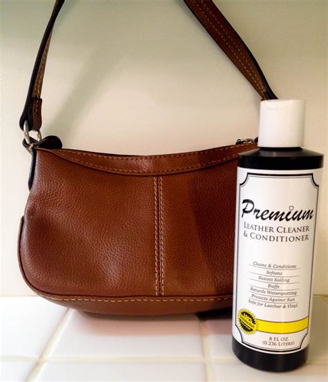 Leather purse cleaner. To clean and freshen up dingy and smelly leather clothing items, follow these instructions: Mix together in a spray bottle: 1 cup of warmed coconut oil. 1 teaspoon of Castile soap. 1-2 drops of essential oil. 1-2 drops of grapefruit seed extract. 4 cups of warm water. Spritz the leather garment with the liquid mixture. 