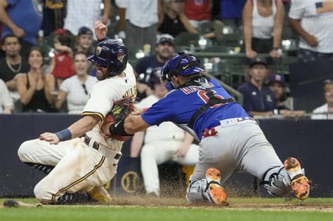 Left fielder Ian Happ saves Cubs with 2 late throws to plate in wild 7-6 win over Brewers in 11
