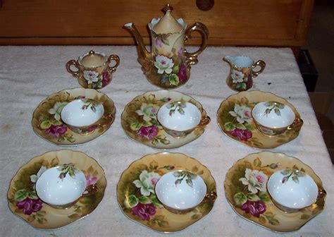 Up for auction is a vintage lefton tea set. Includes tea pot (ne1866) creamer and sugar (ne1867). Heritage Rose collection. Excellent condition. No cracks, chips or scratches. Each piece has the lefton logo on the bottom with the red lefton sticker. Main color scheme is a cream with beautiful red and white rose..