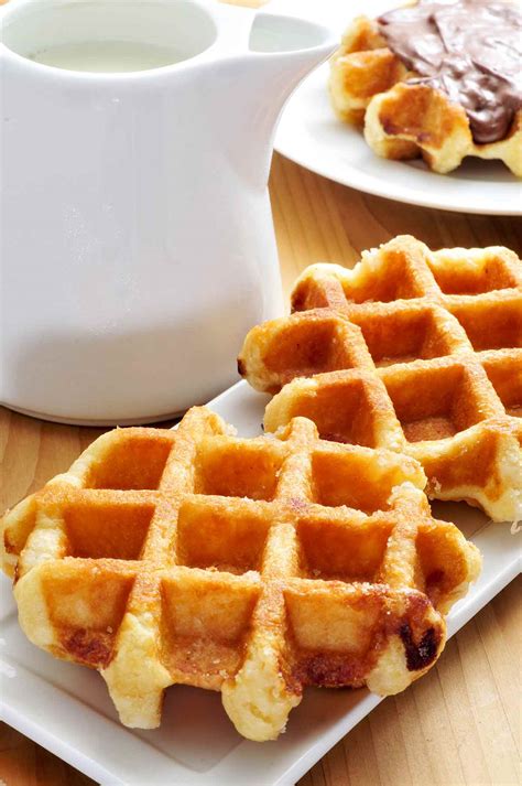 Leige waffles. In a small bowl, whisk together the brown sugar, yeast, and water until well combined. Let stand until foamy, about 5 minutes. Place the flour and salt in a large mixing bowl. Gradually stir in the yeast mixture until the dough is damp and shaggy-looking. 