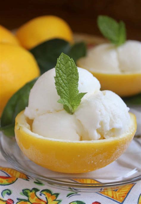 Lemon ice cream. Remove from the heat and cover with a cling film. Set aside for 20 minutes. Meanwhile place the egg, egg yolks and caster sugar in a bowl and mix for a few seconds. Bring the cream with vanilla seeds to a boil once again. Pour 1/3 of the cream over the egg mixture, whisking constantly to prevent curdling, then return the mixture to the saucepan. 