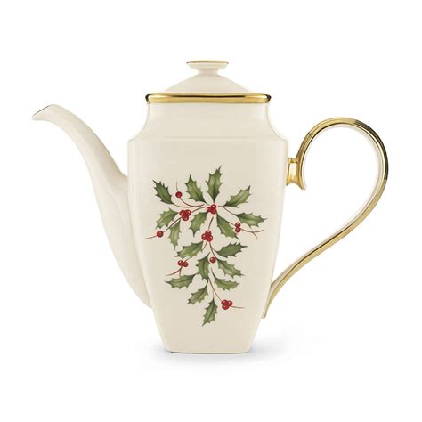 Lenox Holiday Holly Coffee Pot Teapot Christmas Now up for auction is this lovely Lenox Holiday porcelain Coffee/Tea Pot. This teapot is ivory with gold trim and features a holly & berries design. It