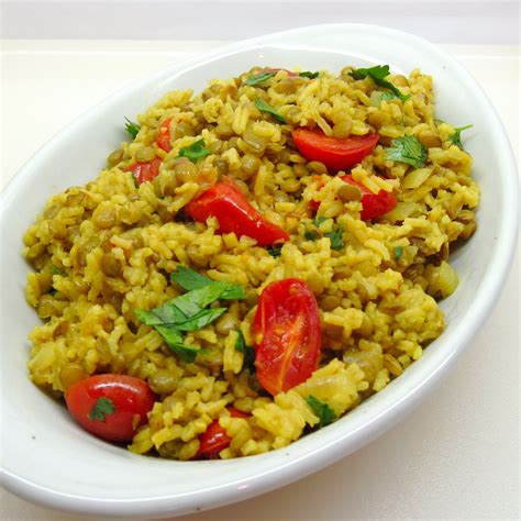 Lentil and rice dish. In a large skillet, heat the coconut oil over medium heat. Once hot, add in the garlic, onion, cumin, coriander, turmeric and salt. Cook for 5 minutes. Stir in the crushed tomatoes, ginger, and water. Cook for 5 additional minutes or until the mixture is heated through and just beginning to show steam. 