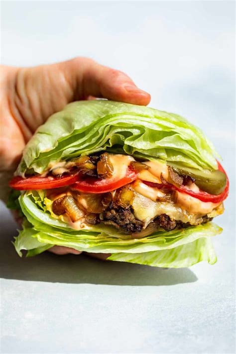 Lettuce wrap burger. These Low Calorie Low Carb Lettuce Wrap Burgers are just 354 calories, have 48.1g of protein and just 2.8 carbs! Best of all, you can make them on the grill, stovetop, or in … 