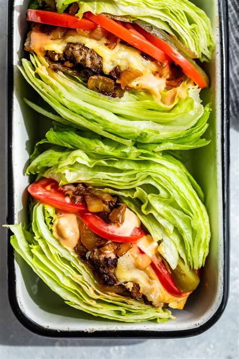 Lettuce wrapped burger. Now, assemble your burgers. Put 1/2 of the lettuce wedge on a plate and add a tomato slice and some pickles at the bottom. Top with a burger patty and spread some sauce over the top. Add on some onions … 