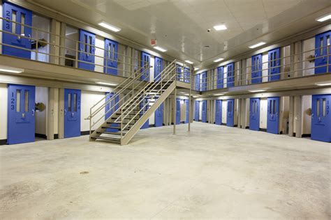 Level 3: Medium Security. In the federal prison definition, medium-security prisons are referred to as Federal Correctional Institutions. This security level usually resembles an enormous residence hall that houses up to 70 inmates at larger, bunked sleeping quarters and group toilet facilities.. 