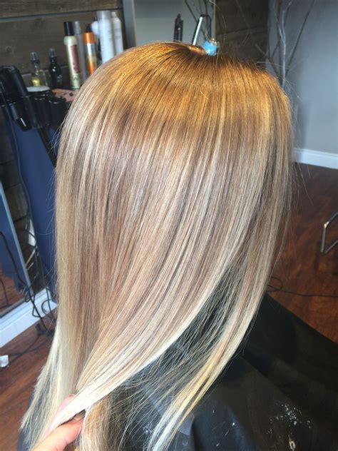 The lift comes courtesy of BlondorPlex + 6%, while the toner is a Color Touch mixture of 10/6 with a touch of 9/36 + 1.9%. If your client already has ash hair but wants to take it brighter and bolder with tones of platinum, this is a great formula to try. Style this ombre balayage with waves for a romantic hairstyle. 5.. 