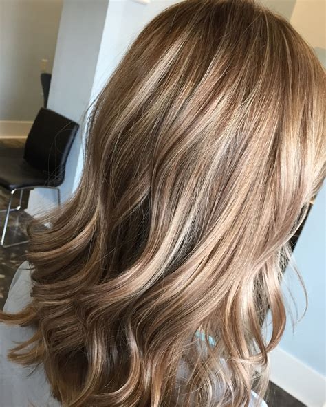 Level 8 blonde hair color. Walnut Blonde. Here's the perfect hue for anyone who prefers to lean more toward darker shades of blonde. "Walnut blonde is warm and creamy all at the same time—a perfect balance of rich and golden blonde," says Bianca Hillier, celebrity colorist and ambassador for Olaplex. "It's not too bright, but is still noticeably blonde." 
