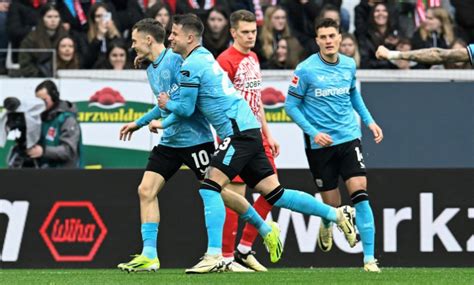 Leverkusen extends unbeaten run under Alonso to 13 games