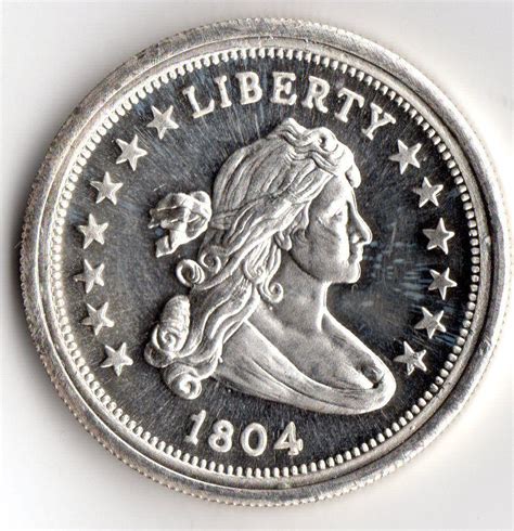 The image of Lady Liberty is so incredibly detailed that even the curls in her hair are easily able to be seen. Being that there is draped clothing over her bust, the Draped Bust coin name makes sense. Above the central image is an inscription reading “Liberty,” while the 1804 year of minting is inscribed below the image.. 
