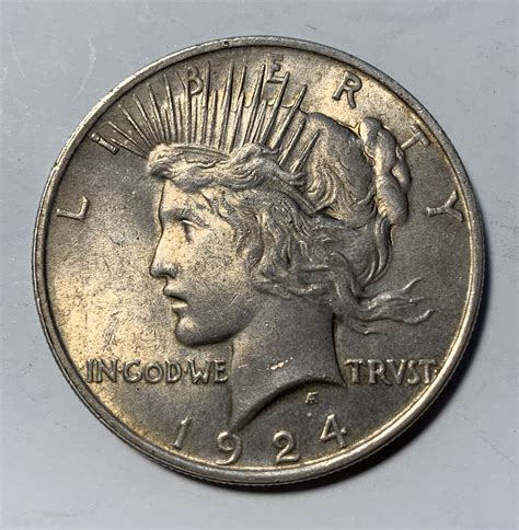 Jan 15, 2023 · However, it also has value as silver. As of July 2022, an ounce of silver is worth approximately $18. Now, if you’re lucky enough to stumble onto a rare silver dollar and it is authentic, then you are looking at a value up to (and maybe beyond) $100,000. A high relief ‘Peace’ dollar from 1922 is incredibly valuable. 