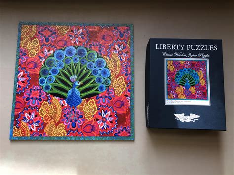 Liberty puzzles. The SILVER SERIES, a series of large-piece puzzles. A beautiful, unique wooden jigsaw puzzle full of odd, whimsy pieces that tell a story. Handcrafted in Boulder, CO — a throwback to the golden ages of vintage wooden puzzles. 447 pieces. Art by Harrison Weir. 