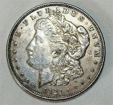 Liberty silver dollar value 1921. The Morgan dollar is a United States dollar coin minted from 1878 to 1904, in 1921, and beginning again in 2021 as a collectible. It was the first standard silver dollar minted since the passage of the Coinage Act of 1873, which ended the free coining of silver and the production of the previous design, the Seated Liberty dollar.It contained 412.5 Troy … 