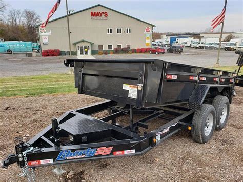 Liberty trailer. This 6.5 x 10 ft utility trailer is equipped with a 3500# Dexter axle that is derated for 2990# GVWR. Liberty trailers come powder coated with spring assist rear ramp and 15-in wheels wrapped in radial trailer tires. Liberty trailers come with a 1-year limited warranty and a 3-year structural warranty against manufacturer defects. Steel Frame 