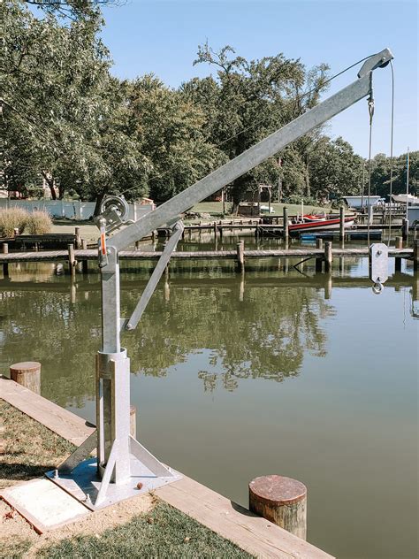 Lifting a boat with davits.  The davits are constructed using rectangu...