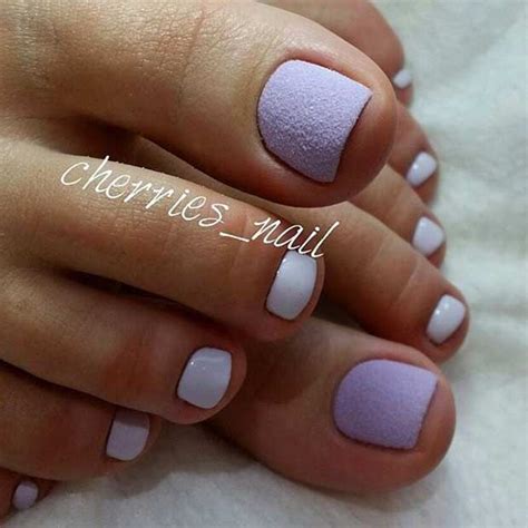 This pedicure captures the spirit of this fun pattern perfectly. Start with a mushroom, gray-brown base, then create a horizontal and vertical line with white polish. Layer black lines on top, then add a few red wine lines to create more depth. Paint your remaining colors the red wine hue. 09 of 10.. 