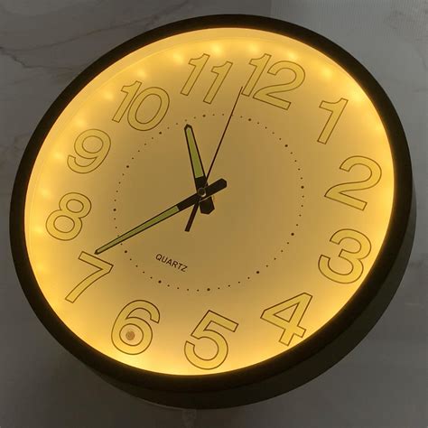 Lighted wall clock.  On this day, participating states will turn their cloc...