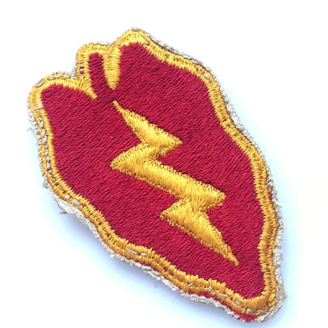 Approved on 1 September 2009, the 65th Field Artillery Brigade unit patch includes a lightning flash crossed with a cannon, an arced rectangle diagonally divided into blue and red halves, a pair of dice showing a 6 and a 5, and a small circle with a white disc in the center. The disc is a reference to the I Corps insignia (except it has a black .... 