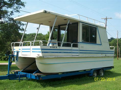 Lil' HOBO CATARMARAN CRUISER WEEKENDER 1995 for sale for $5,000 Remodeled 1995 8.5' by 30' Lil' Hobo Catarmaran Cruiser Houseboat including a very good 2004 EFI50 HP4-StrokeMercury Motor as well as a heavy duty dual axle Bunk Style Trailer that was made specifically for this boat.. 