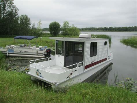Lil hobo houseboat for sale. 1998 Catamaran Cruiser 35`x10` trailerable houseboat with 1999 Honda 90 outboard. Excellent condition!! Doesn`t look half its age! Extremely solid boat, no soft spots in roof or floor! Remodeled in June 2018 with LED lighting, curtains, bunk bed, and vinyl plank flooring. Entire boat was gone through and is completely functional, needing nothing! I have 2,500 in receipts since June. Ne 