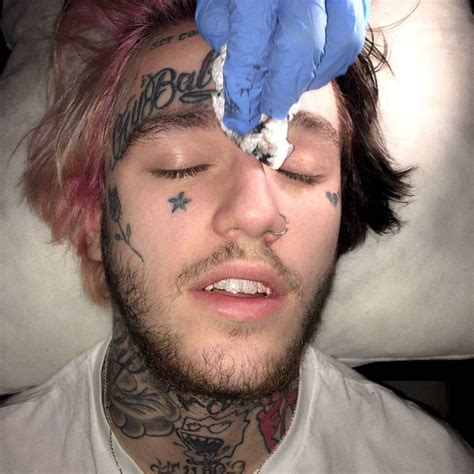 Lil peep tat. Consider google image searching Lil Peep, pretty interesting lookin dude. It likely got so many likes despite being a god awful tat because Lil Peep had lots of younger clique like fans who have become even more obsessed with him since his death in December (I think) from overdosing on Xanax 