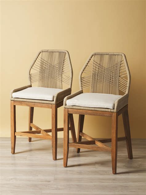 The chair is constructed by tightly weaving a taupe and white colored rope in a vertical pattern, creating a unique look with a coastal vibe. The removable seat .... 
