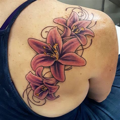 Lily tattoo ideas. Spider Lily Tattoo Ideas. 1. Spider Lily Chest Tattoo for Women. A graceful Spider Lily blooms across the chest, symbolizing strength and femininity. 2. Spider Lily and Fish Body Art. nana.orient. This tattoo signifies the interconnectedness of life, flowing seamlessly like water. 3. 